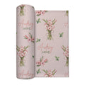 Blush pink swaddle blanket with pink gladiolus bouquets, scattered green leaves, and the name Audrey Jane repeated throughout.