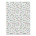 Baby Dinosaurs blanket personalized with Adam, featuring pastel green, blue, and peach dinosaurs, plants, eggs, and volcanoes.