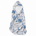 A white hooded baby towel featuring a repeating pattern of blue watercolor-style dinosaurs and the name 'COLTON' printed in dark blue text.