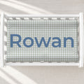 Personalized dusty sage gingham baby changing pad cover with name Rowan centered.