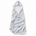 A white baby towel with a hood, decorated with light blue star and dot patterns and personalized with the name 'SEBASTIAN' in blue text.