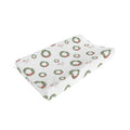 A white baby changing pad cover featuring a repeating pattern of green wreaths with red bows, shown on a clean white background.
