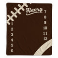 Personalized football baby milestone blanket with custom name, football stitching design, and months 1–12