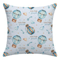 A square throw pillow featuring a light blue watercolor print of hot air balloons, clouds, stars, and the personalized name 'COLTON joseph' repeated across the front.