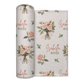 Ivory swaddle blanket with peach rose bouquets, scattered green leaves, and the name Isabella Rose in coral and green lettering.