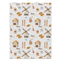 Personalized Farm Baby Blanket. Illustrated farm buildings, windmills, and countryside details surround a custom name in warm earthy colors.