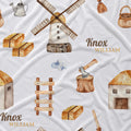 White fabric printed with a repeating pattern of rustic watercolor illustrations, including a windmill, small houses, an axe on a stump, hay bales, a watering can, and the text 'Knox WILLIAM'.