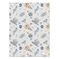 A personalized baby blanket featuring a space-themed pattern with planets, rockets, satellites, and stars. The design includes the custom text 'Jett James' repeated throughout on a light cream background.