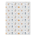 A square fabric item, likely a blanket or towel, featuring a repeating space-themed pattern with astronauts, rockets, planets, and stars on a light gray background.