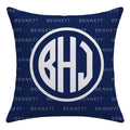 A square navy blue throw pillow featuring a large white circular monogram with the letters B, H, and J in the center. The background of the pillow has a repeating light gray 'Bennett' brand name pattern.