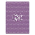 A square personalized monogrammed blanket in lavender purple with a repeating 'PALMER' pattern and a central white monogram circle containing 'P, 'S', and 'C'.