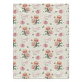 Ivory blanket with peach and pink chrysanthemums, green foliage, and the name Scarlett Mae in rose script and green lettering.