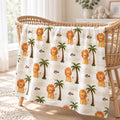 Little Lion blanket personalized with Leo, featuring golden lions, green palms, and cream stripes, draped over a woven bassinet.