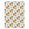 Full view of Little Lion baby blanket with repeating golden lions, green palm trees, and Leo in brown script over cream and white stripes.