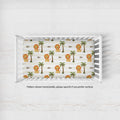 Little Lion crib sheet personalized with Leo, shown horizontally in a white crib; caption notes vertical pattern orientation is available by request.
