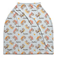 Flat view of the Monster Trucks personalized baby car seat cover with brown Ryder lettering and watercolor trucks on a pale blue background.
