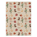 A rectangular blanket with a western-themed pattern featuring cacti, cowboy hats, boots, horseshoes, stars, and the word 'SCOUT' repeated on a warm beige background.