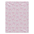 A baby blanket with a light pink background, featuring a repeating pattern of darker pink bows and small pink stars. Some names are personalized in the design, including 'Charlotte' and 'Mae'.