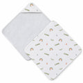 Two square baby hooded towels on a white background with a white background with a repeating pattern of small rainbows, leaves, stars, and the name 'ELIANNE' in olive green.