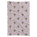 Mauve-pink swaddle blanket with lavender aster bouquets, golden centers, green leaves, and the name Evelyn Claire.