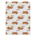 Personalized Sloth Baby Blanket. Cozy sloths resting on branches, golden moons, and little stars surround a custom name on a white background.