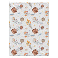 A personalized blanket with a space-themed print featuring cartoon astronauts, planets, stars, and the name 'Rowan QUINN' repeated on a white background.