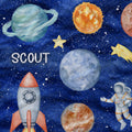 Watercolor-style space-themed fabric featuring planets, stars, a rocket, and an astronaut on a blue starry background, with the word "SCOUT" printed in white near the left side.