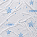 White fabric with a pattern of light blue stars, dots, and the name 'SEBASTIAN' printed in blue, shown as a close-up texture shot.