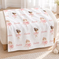 A white blanket with a repeating pattern of ballerina illustrations and the name 'Isabella' is draped over a cream-colored armchair in a bright, softly lit room.