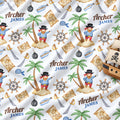 Custom printed blanket featuring a pirate theme with palm trees, treasure maps, ship's wheels, swords, and a pirate ship. The design includes the personalized name 'Archer James' in blue text.
