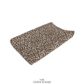 A baby changing pads cover featuring a classic leopard print pattern in beige, brown, and black.