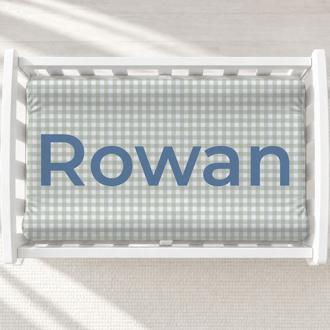Personalized dusty sage gingham baby changing pad cover with name Rowan centered.