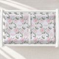 Blush Rose Garden changing pad cover with pink roses, sage leaves, and the name Elizabeth Rose, shown on a white changing table.