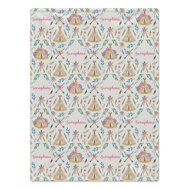 Personalized Boho Floral Baby Girl Blanket. Rose-colored flowers, leafy sprigs, feathers, and illustrated teepees surround a custom name in a whimsical boho design.