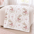 Personalized Ballet Bunny Baby Girl Blanket. Sweet dancing bunnies in soft pink ballet outfits bring storybook charm to a custom name.