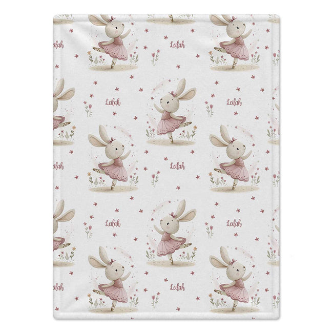 Personalized Ballet Bunny Baby Girl Blanket. Sweet dancing bunnies in soft pink ballet outfits bring storybook charm to a custom name.
