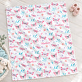 Personalized Pink and Aqua Butterfly Baby Girl Blanket. Pink butterflies, aqua leaves, and delicate flowers surround a custom name on a bright white background.