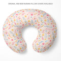 A U-shaped nursing pillow cover with a delicate pastel floral print on a cream background, featuring the personalized name 'AMELIA grace' in blue script. The product is displayed on a clean white background with promotional text at the top.