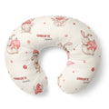 A U-shaped baby nursing pillow with a cream background, decorated with watercolor-style bunnies in red and pink, and the personalized name 'CHARLOTTE annl' printed in red and black.