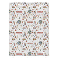 A rectangular white fabric item, likely a baby blanket or towel, featuring a repeating school-themed pattern with books, globes, rulers, pencils, and apples. The name 'MORGAN' is printed repeatedly in red across the design.