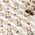 Personalized Cow Baby Blanket. Sweet cows and soft cloud details create a gentle countryside setting for a custom name.