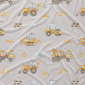 Light gray fabric with a repeating pattern of yellow construction vehicles, including excavators, bulldozers, a cement mixer truck, road rollers, barriers, and small traffic cones.