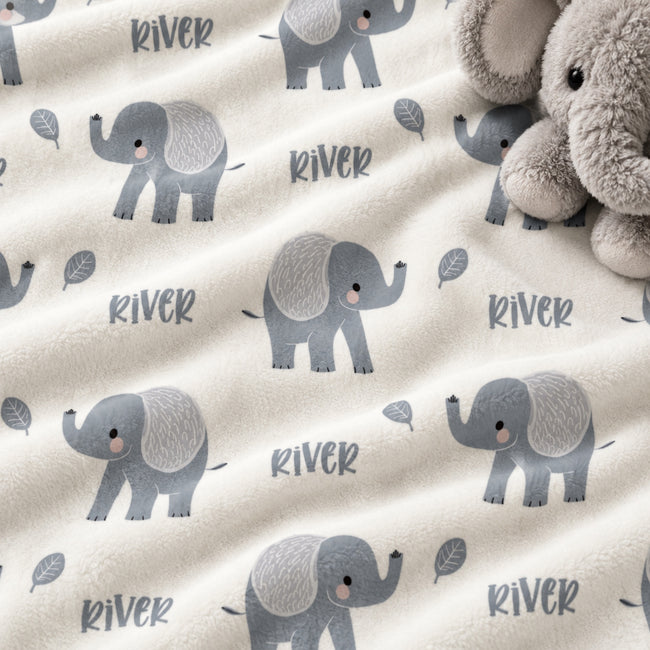 Personalized Grey Elephant Baby Blanket. Sweet grey elephants surround a custom name in a simple, gentle design on a white background.