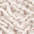A close-up of a plush fleece blanket with a repeating pattern of cartoon chickens, small pink flowers, and the text 'clara mae' printed in pink and green.