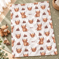 Personalized Highland Cow Baby Blanket. Fluffy highland cows and warm earthy details surround a custom name in a charming rustic design.