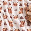 Personalized Highland Cow Baby Blanket. Fluffy highland cows and warm earthy details surround a custom name in a charming rustic design.