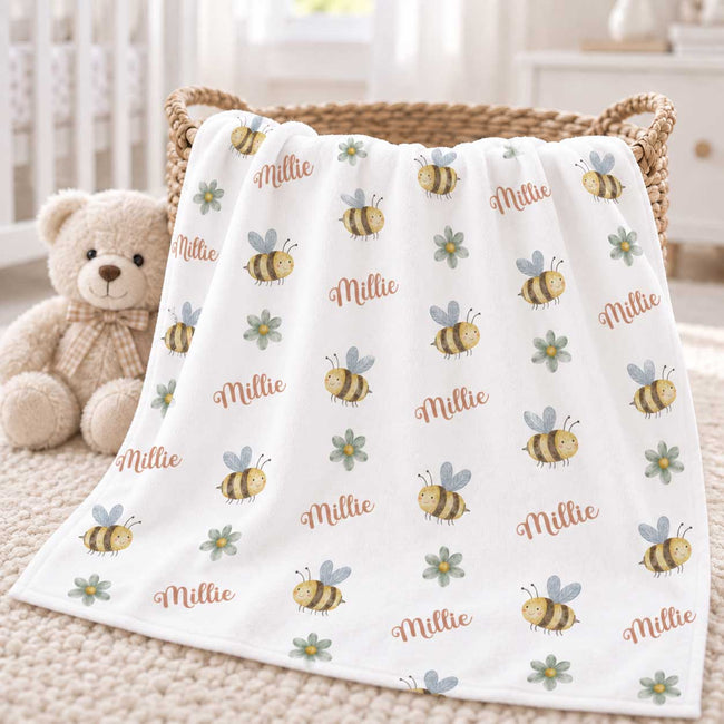 Personalized Bee Baby Girl Blanket. Sweet bees and small floral accents bring sunny garden charm to a custom name.