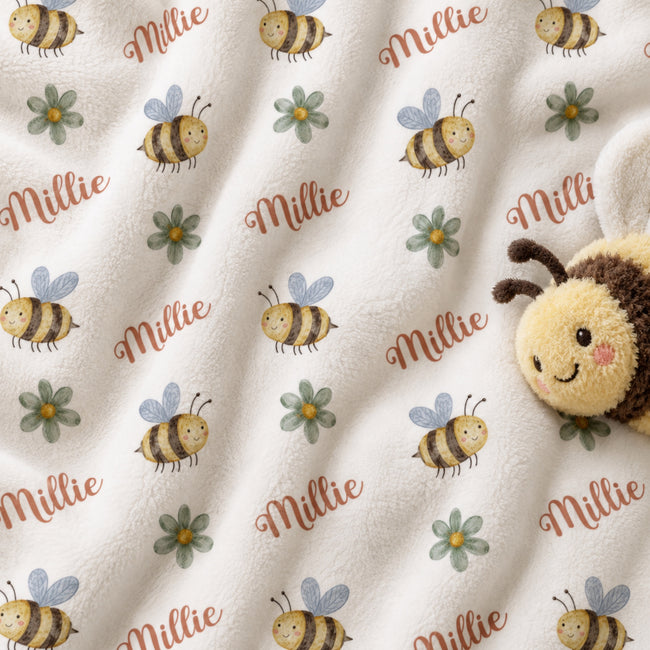 Personalized Bee Baby Girl Blanket. Sweet bees and small floral accents bring sunny garden charm to a custom name.
