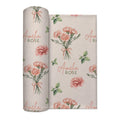 Cream swaddle blanket with peach-pink carnation bouquets, green leaves, and the name Amelia Rose in coral and green lettering.