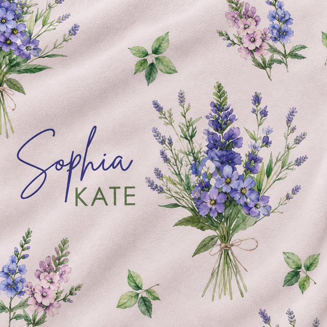 A fabric swatch featuring a watercolor floral pattern with purple and pink Larkspur flowers, green leaves, and the text 'Sophia KATE' in blue and green script on a light blush pink background.